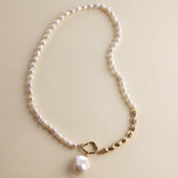 Embrace the beauty of asymmetry with this stunning Baroque freshwater pearl necklace. Featuring a lustrous Baroque pearl pendant, this piece stands out with its natural glow and unique shape. The pendant is detachable, allowing you to add it to other necklaces for a customized look. The chain and accents are crafted from 18k gold-filled materials, ensuring long-lasting color and a beautiful shine that complements the pearls.