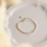Gold and pearls are a timeless combination that never fails to impress. This delicate pearl bracelet, paired with a matching necklace, makes the perfect accessory duo to elevate any outfit. I’ve included styling references in the listing photos to give you inspiration on how to wear it.
- Pearl Size: 
- Bracelet Length:
- Extension Chain: 
Styling Tips:
Pair this bracelet with its matching pearl necklace for a cohesive, elegant look. It’s perfect for layering with other gold or pearl pieces to add a touch o
