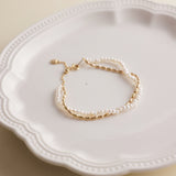 Gold and pearls are a timeless combination that never fails to impress. This delicate pearl bracelet, paired with a matching necklace, makes the perfect accessory duo to elevate any outfit. I’ve included styling references in the listing photos to give you inspiration on how to wear it.
- Pearl Size: 
- Bracelet Length:
- Extension Chain: 
Styling Tips:
Pair this bracelet with its matching pearl necklace for a cohesive, elegant look. It’s perfect for layering with other gold or pearl pieces to add a touch o