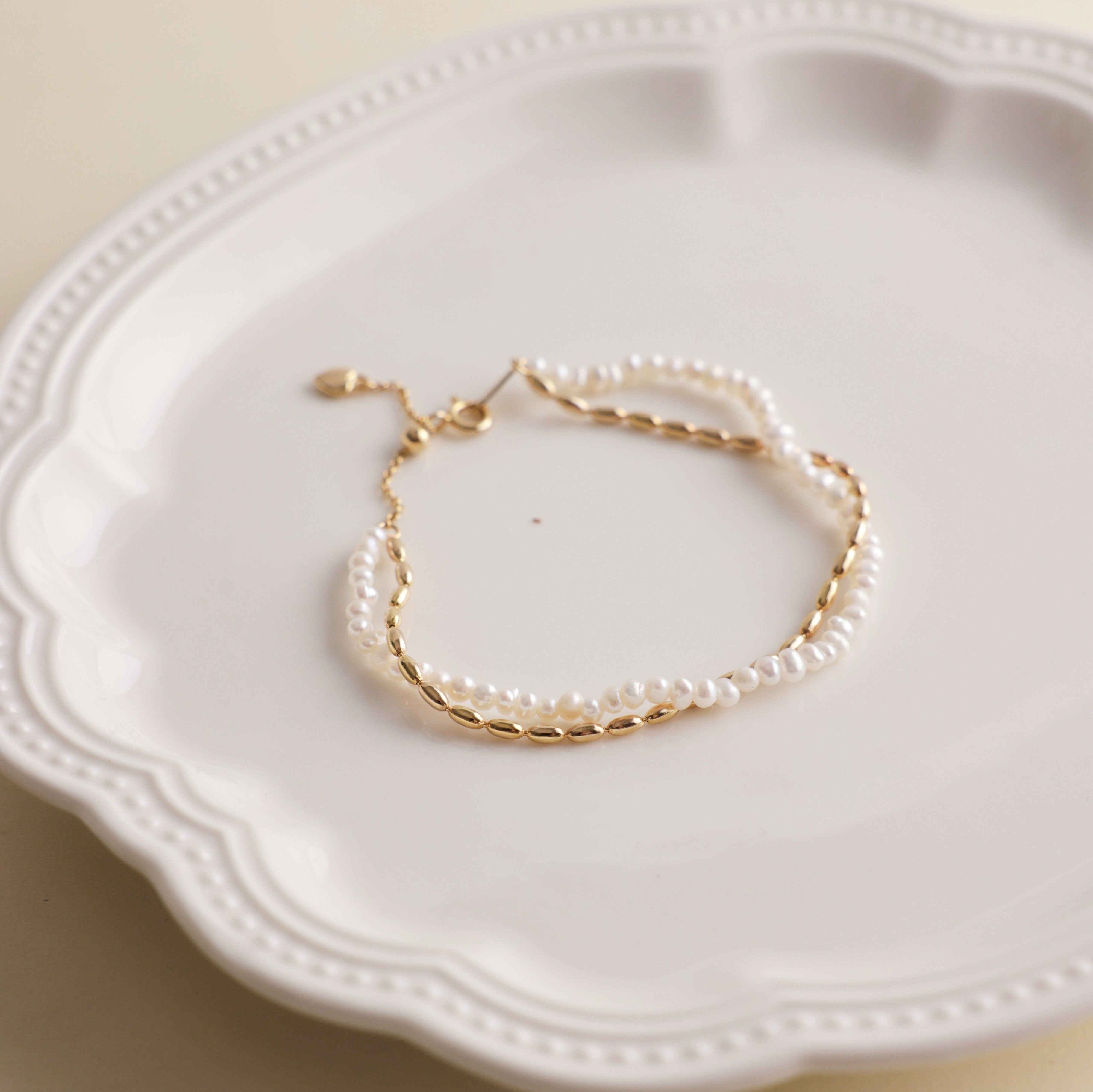 Gold and pearls are a timeless combination that never fails to impress. This delicate pearl bracelet, paired with a matching necklace, makes the perfect accessory duo to elevate any outfit. I’ve included styling references in the listing photos to give you inspiration on how to wear it.
- Pearl Size: 
- Bracelet Length:
- Extension Chain: 
Styling Tips:
Pair this bracelet with its matching pearl necklace for a cohesive, elegant look. It’s perfect for layering with other gold or pearl pieces to add a touch o