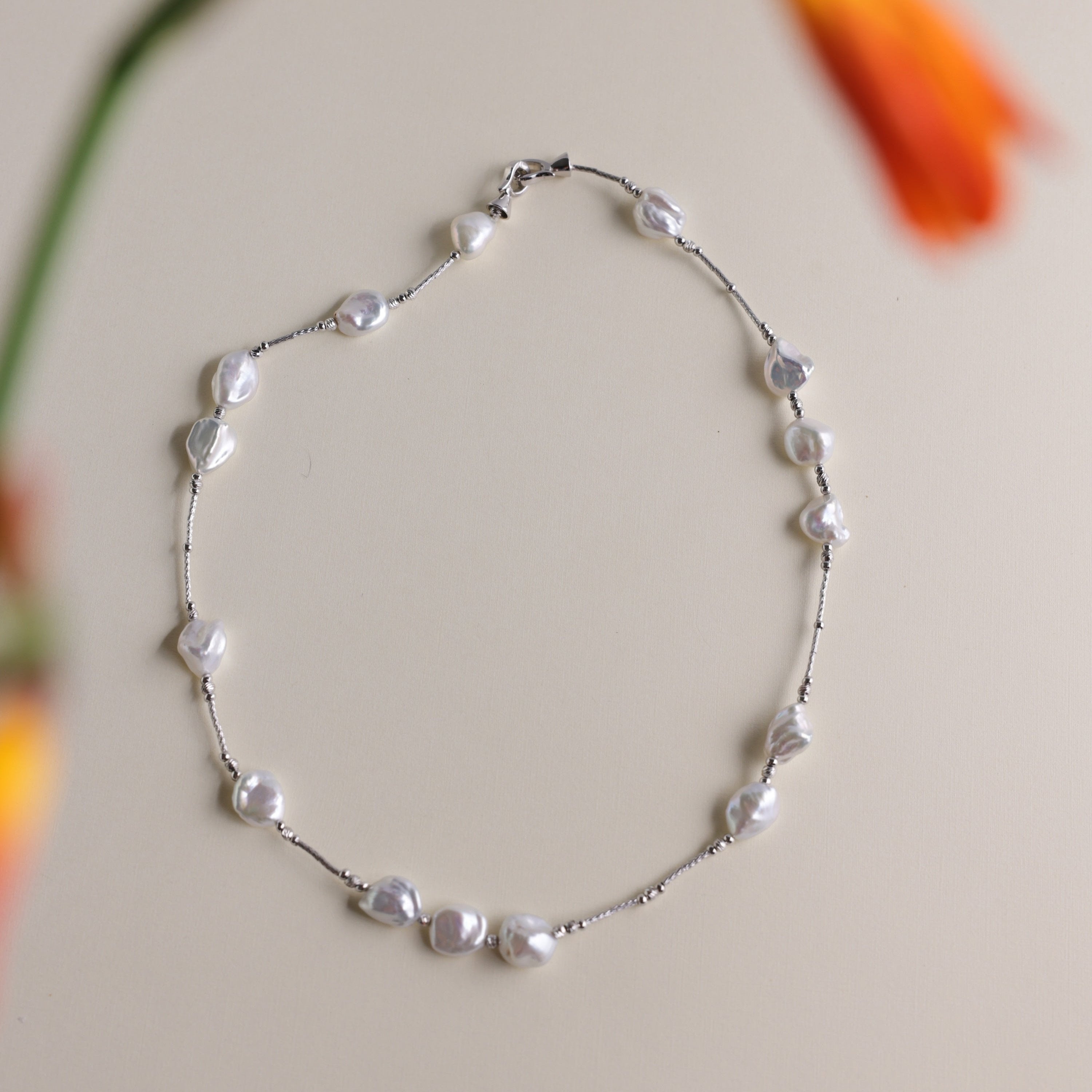 Elegant Keshi Pearl Necklace with Fine 925 Sterling Silver Accents | Real Freshwater Pearls | Christmas gift for her, birthday gift for women
Materials:
- 15 Keshi Pearls: Known for their irregular shapes and exquisite luster.
- 925 Sterling Silver Accents: Provides a durable and stylish framework that enhances the pearls' natural beauty.
- Length: Approximately 40 cm, designed to sit perfectly around the base of the neck.
Gift Idea: 
The Keshi Pearl Necklace makes a perfect gift for special occasions like 