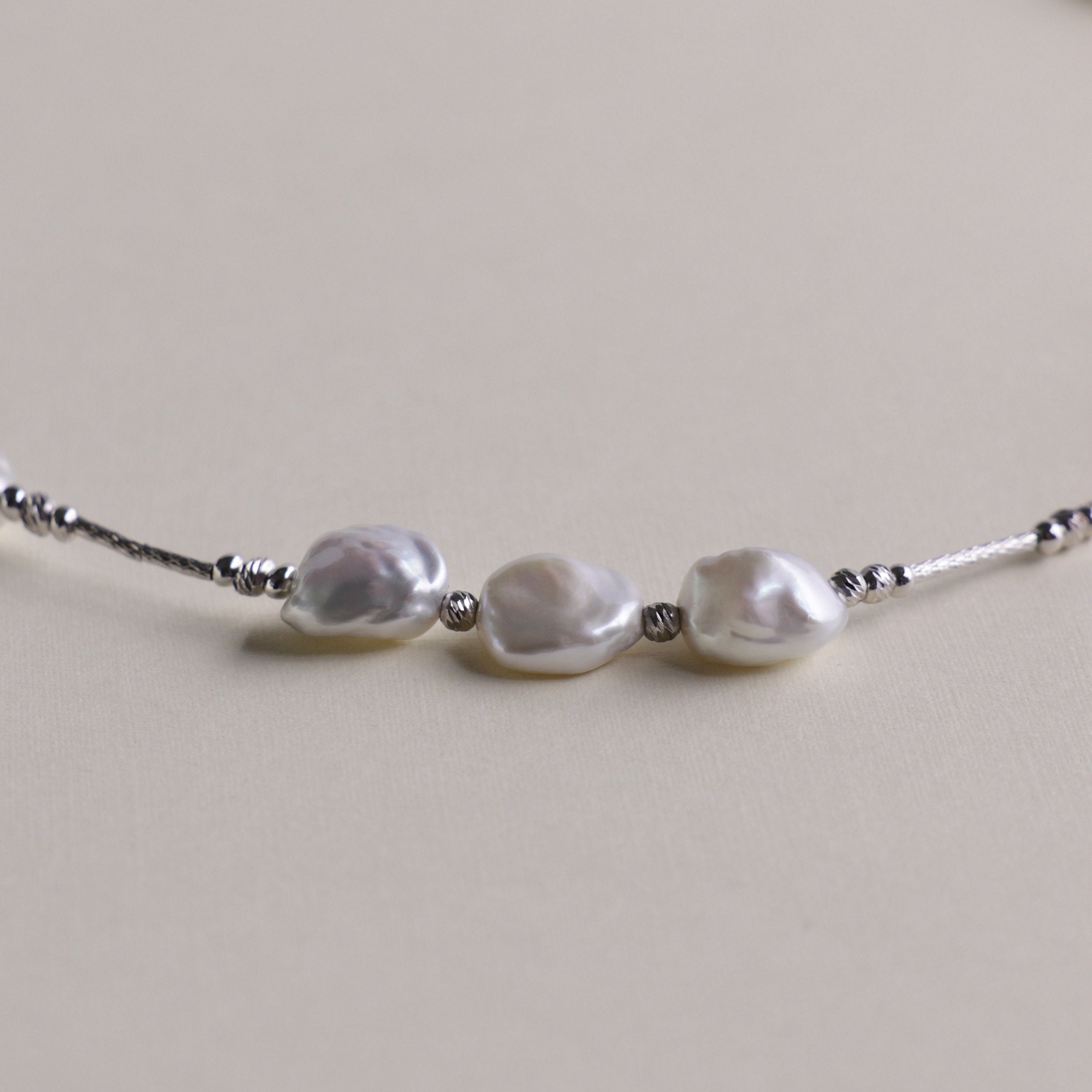 Elegant Keshi Pearl Necklace with Fine 925 Sterling Silver Accents | Real Freshwater Pearls | Christmas gift for her, birthday gift for women
Materials:
- 15 Keshi Pearls: Known for their irregular shapes and exquisite luster.
- 925 Sterling Silver Accents: Provides a durable and stylish framework that enhances the pearls' natural beauty.
- Length: Approximately 40 cm, designed to sit perfectly around the base of the neck.
Gift Idea: 
The Keshi Pearl Necklace makes a perfect gift for special occasions like 