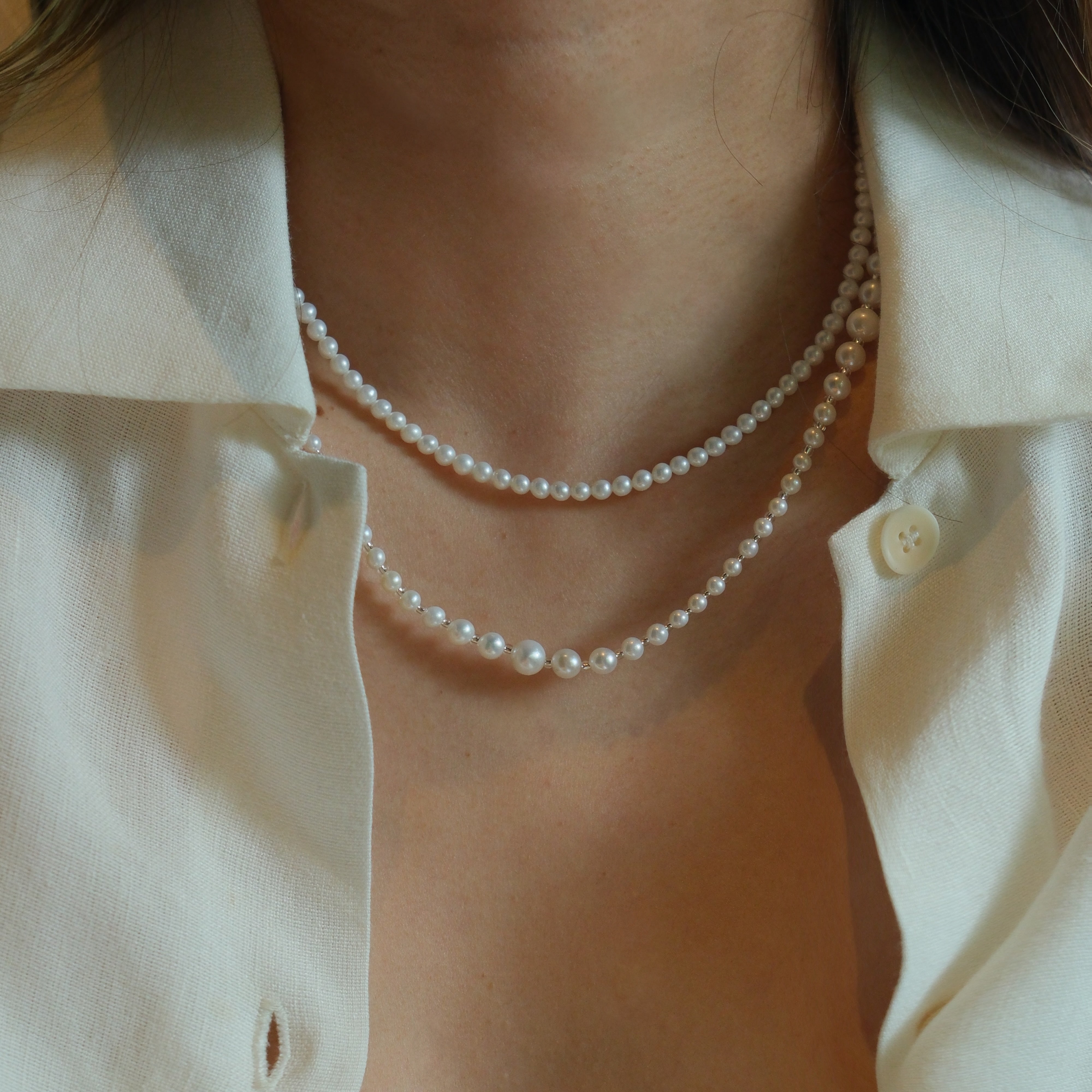 Product Description: This beautiful set of two freshwater pearl necklaces is designed to be worn together or separately for an effortlessly chic layered look. The necklaces feature smooth, round pearls with a radiant luster that will add sophistication to any outfit. Whether you’re dressing up for an event or adding a touch of elegance to your everyday style, these pearl necklaces are perfect for enhancing your wardrobe.
Materials & Craftsmanship: Handcrafted with the finest natural freshwater pearls, each 