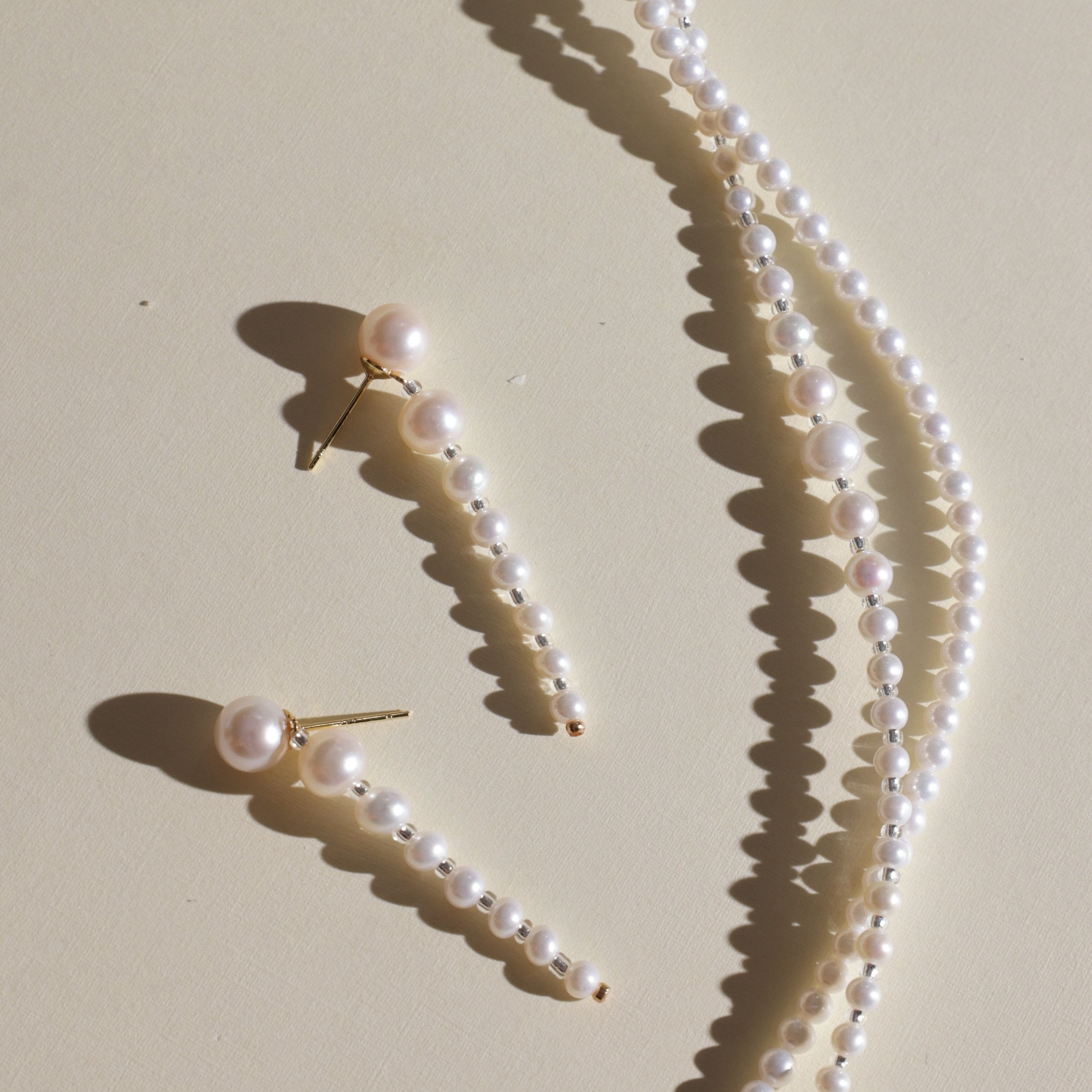 These elegant earrings are made with eight beautifully round and smooth Freshwater Akoya pearls, arranged from largest to smallest. The lustrous pearls will add a delicate and sophisticated touch to your outfit, whether it’s for a casual day or a special evening event. Each pearl’s natural beauty is sure to catch the light and enhance your look.
Materials & Craftsmanship: We use only the finest Freshwater Akoya pearls, carefully selected for their luster and quality. Each pair of earrings is handmade with a