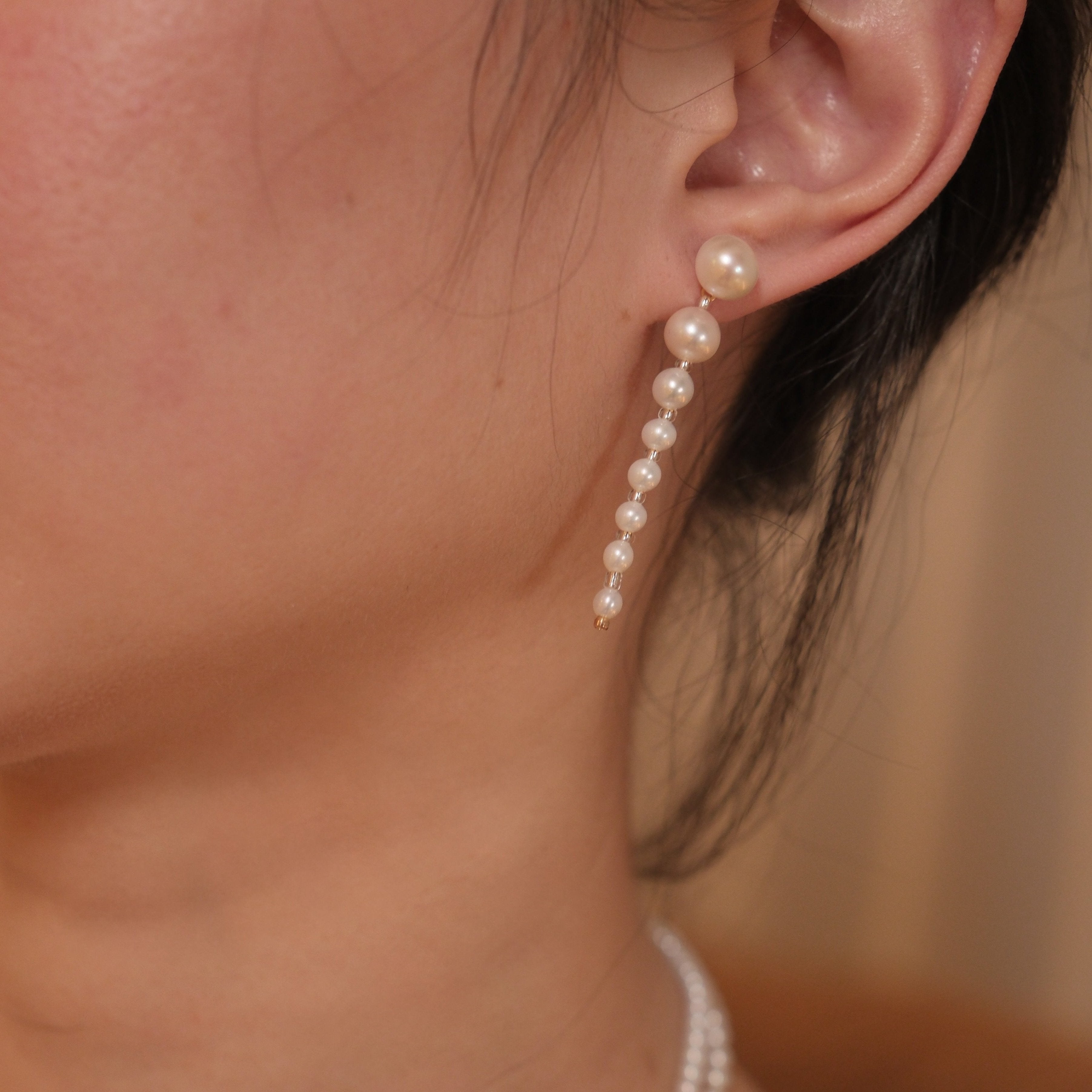 These elegant earrings are made with eight beautifully round and smooth Freshwater Akoya pearls, arranged from largest to smallest. The lustrous pearls will add a delicate and sophisticated touch to your outfit, whether it’s for a casual day or a special evening event. Each pearl’s natural beauty is sure to catch the light and enhance your look.
Materials & Craftsmanship: We use only the finest Freshwater Akoya pearls, carefully selected for their luster and quality. Each pair of earrings is handmade with a