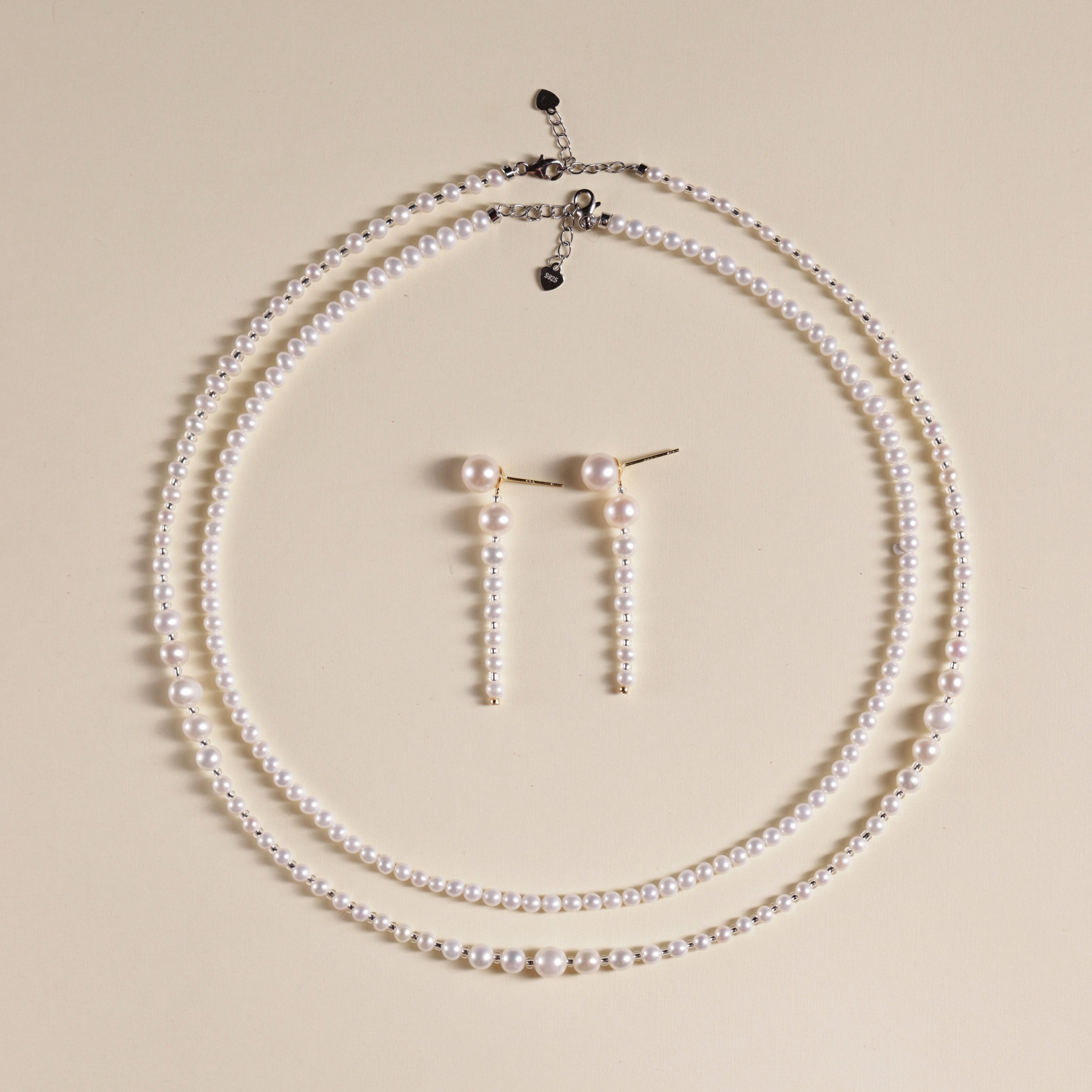 These elegant earrings are made with eight beautifully round and smooth Freshwater Akoya pearls, arranged from largest to smallest. The lustrous pearls will add a delicate and sophisticated touch to your outfit, whether it’s for a casual day or a special evening event. Each pearl’s natural beauty is sure to catch the light and enhance your look.
Materials & Craftsmanship: We use only the finest Freshwater Akoya pearls, carefully selected for their luster and quality. Each pair of earrings is handmade with a