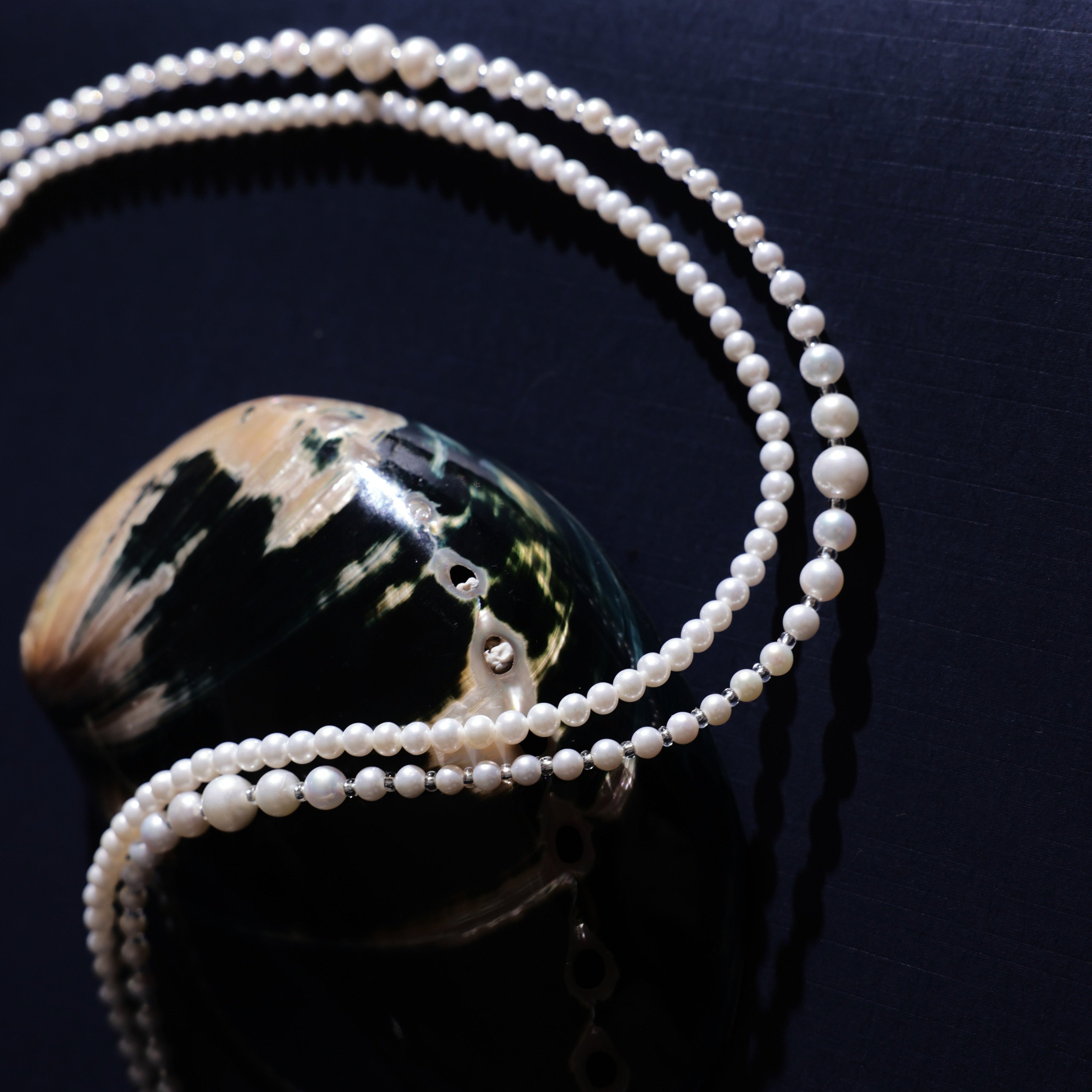 Product Description: This beautiful set of two freshwater pearl necklaces is designed to be worn together or separately for an effortlessly chic layered look. The necklaces feature smooth, round pearls with a radiant luster that will add sophistication to any outfit. Whether you’re dressing up for an event or adding a touch of elegance to your everyday style, these pearl necklaces are perfect for enhancing your wardrobe.
Materials & Craftsmanship: Handcrafted with the finest natural freshwater pearls, each 