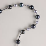 This striking necklace features a luxurious combination of rich Tahitian black pearls and radiant blue Akoya pearls, delicately spaced to create an elegant contrast. The deep, dark hues of the black pearls pair beautifully with the soft, iridescent glow of the blue Akoya pearls, making this necklace a standout piece. Whether worn for a special occasion or to elevate your everyday style, this necklace brings a touch of the exotic to any outfit. Tahitian black pearls are symbols of mystery, independence, and 