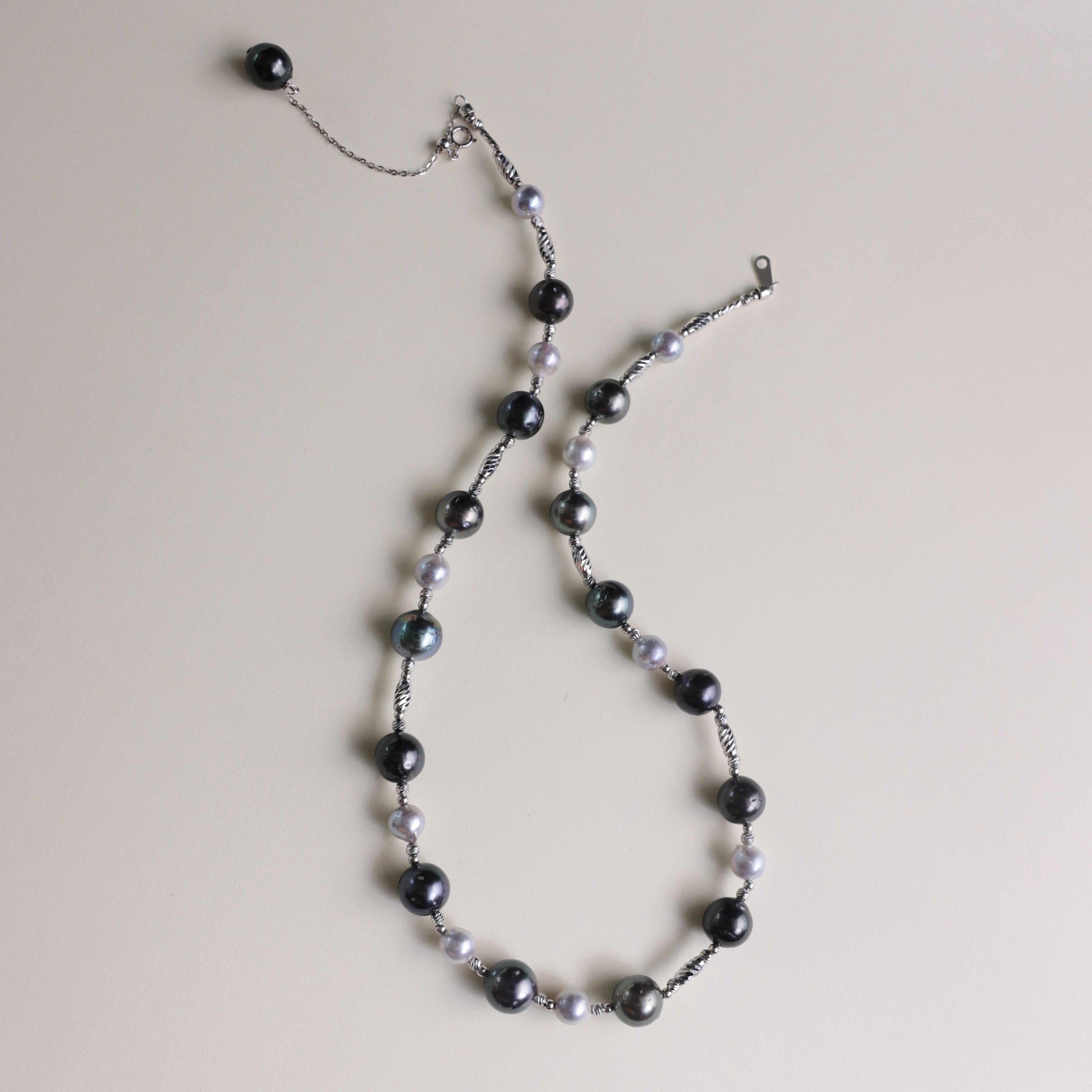 Tahitian black pearls are symbols of mystery, independence, and strength, while blue Akoya pearls represent serenity, elegance, and beauty. Together, they make this necklace not only a fashionable statement but also a meaningful piece that celebrates both bold individuality and refined grace.