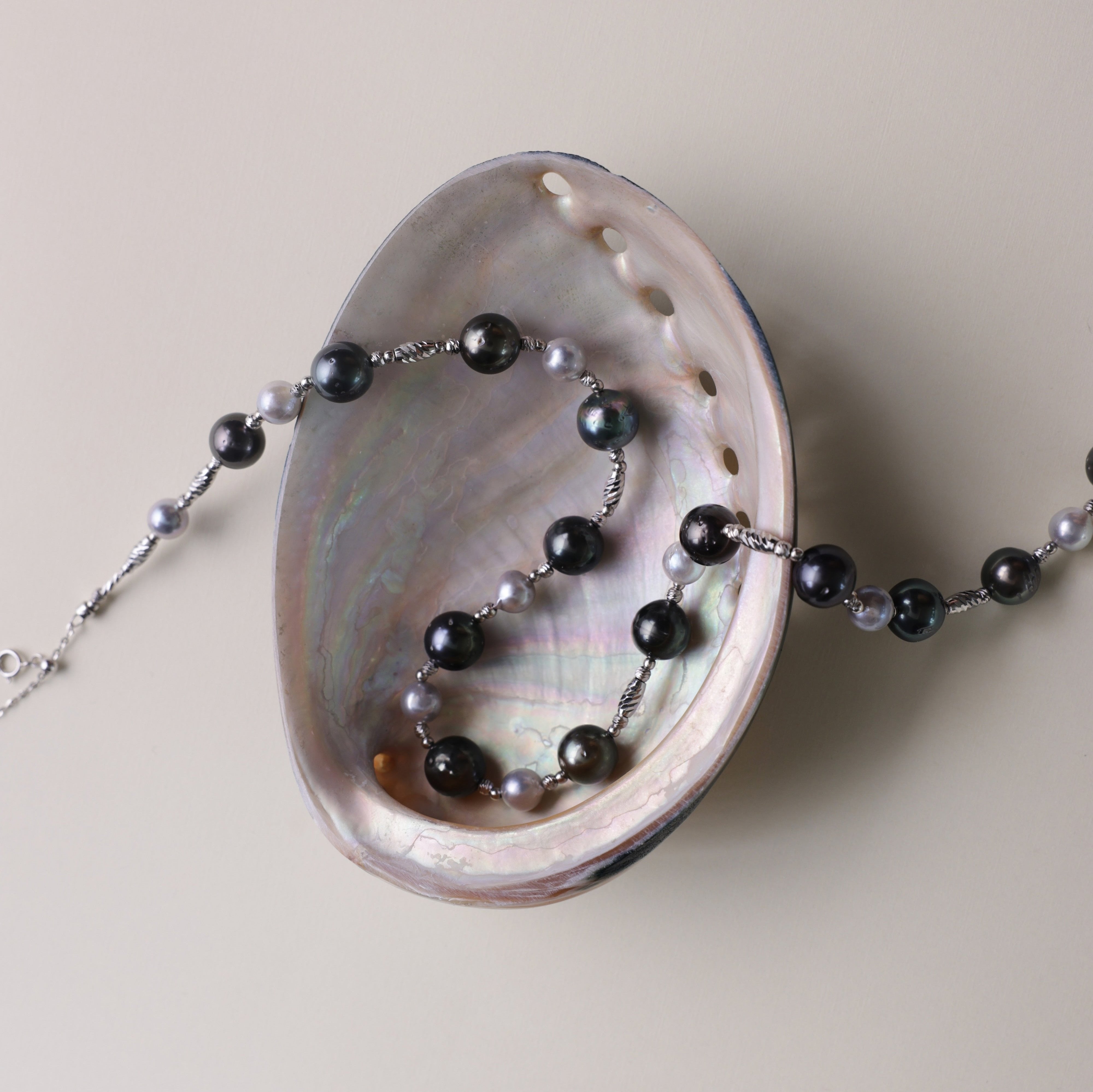 Tahitian black pearls are symbols of mystery, independence, and strength, while blue Akoya pearls represent serenity, elegance, and beauty. Together, they make this necklace not only a fashionable statement but also a meaningful piece that celebrates both bold individuality and refined grace.