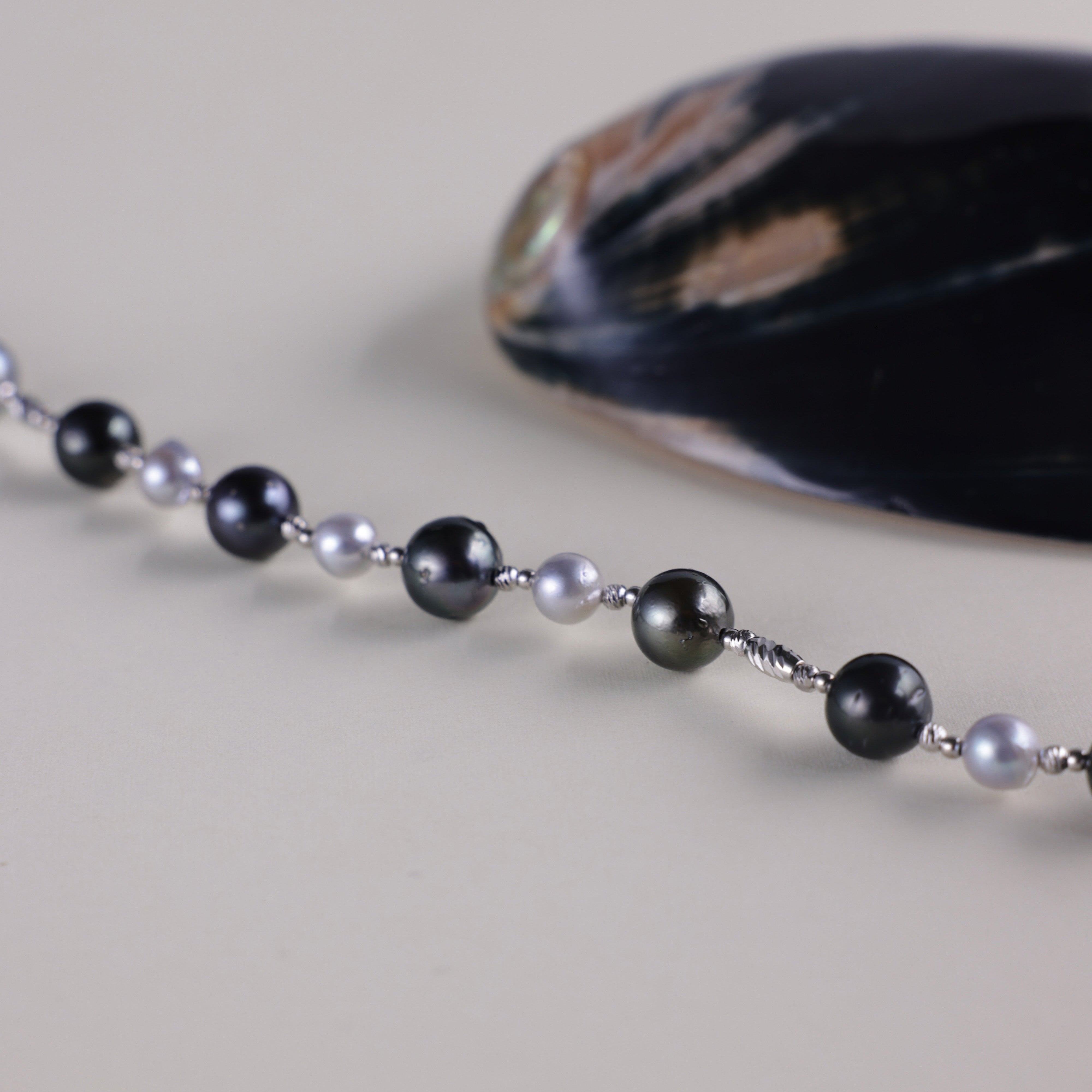 Tahitian black pearls are symbols of mystery, independence, and strength, while blue Akoya pearls represent serenity, elegance, and beauty. Together, they make this necklace not only a fashionable statement but also a meaningful piece that celebrates both bold individuality and refined grace.