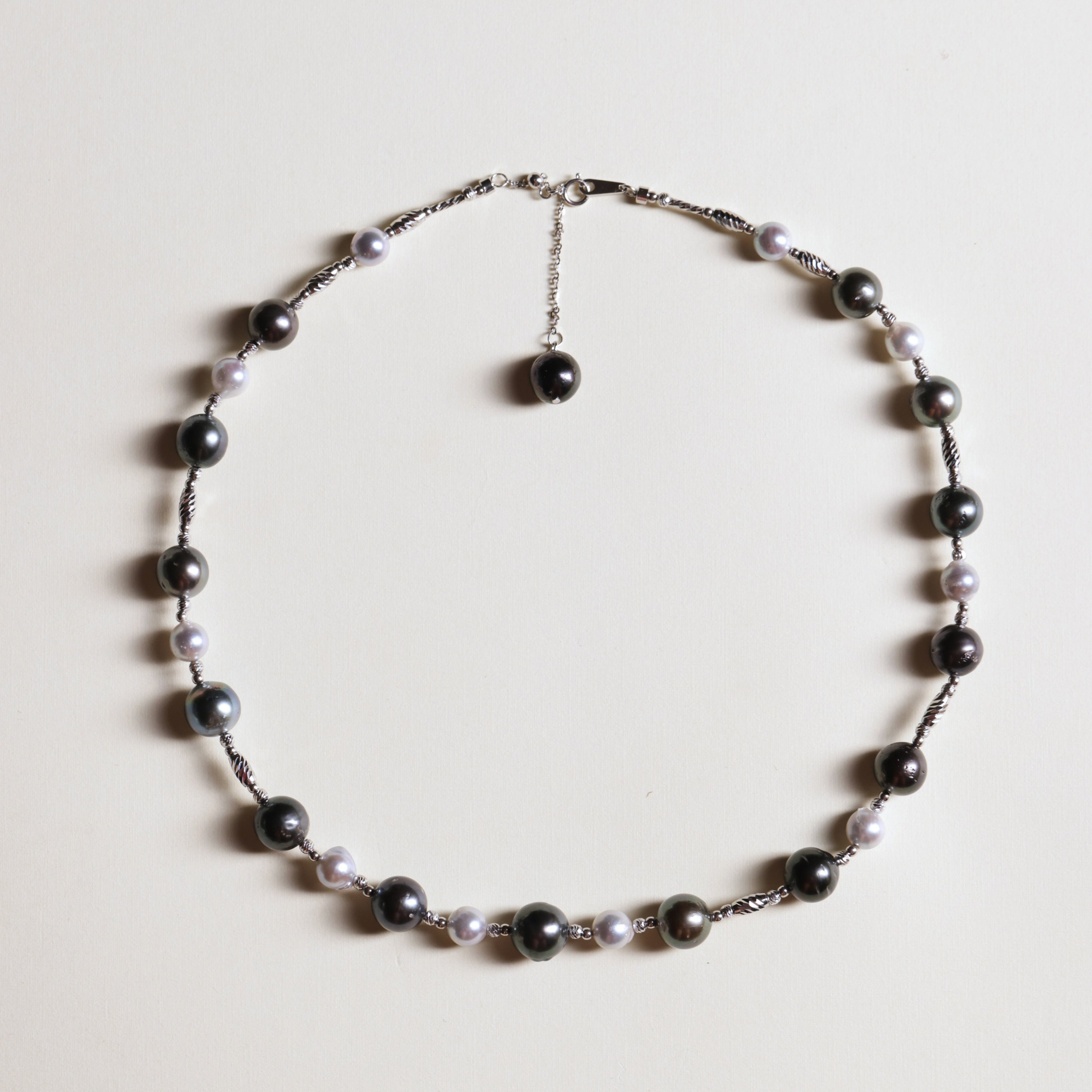 Tahitian black pearls are symbols of mystery, independence, and strength, while blue Akoya pearls represent serenity, elegance, and beauty. Together, they make this necklace not only a fashionable statement but also a meaningful piece that celebrates both bold individuality and refined grace.
