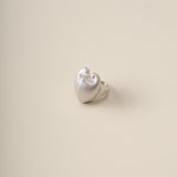 A sculptural ode to nature’s duality, the Meiocardia Vulgaris Heart Ring transforms the organic beauty of a rare marine shell into a bold, wearable statement. Crafted for those who seek depth in simplicity, this ring marries raw texture with refined elegance, embodying the balance of strength and sensitivity.
Design & Craftsmanship:
Dual-Texture Band: The ring’s surface transitions from rugged, shell-inspired ridges to a smooth, polished heart motif at its center—meticulously modeled from a 3D scan of the M