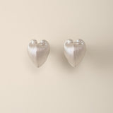 A bold yet balanced statement for the ears, the Cœur Brillant Heart Stud Earrings redefine minimalist elegance with their striking duality. Designed to celebrate contrasts, these earrings blend organic inspiration with celestial precision, offering a wearable metaphor for embracing life’s multifaceted beauty.
Design & Craftsmanship:
Dual-Texture Heart Design: Each 15.6*18.8mm earring features the Meiocardia vulgaris heart motif, cast in S925 silver and plated in your choice of 18k gold or white gold. The de