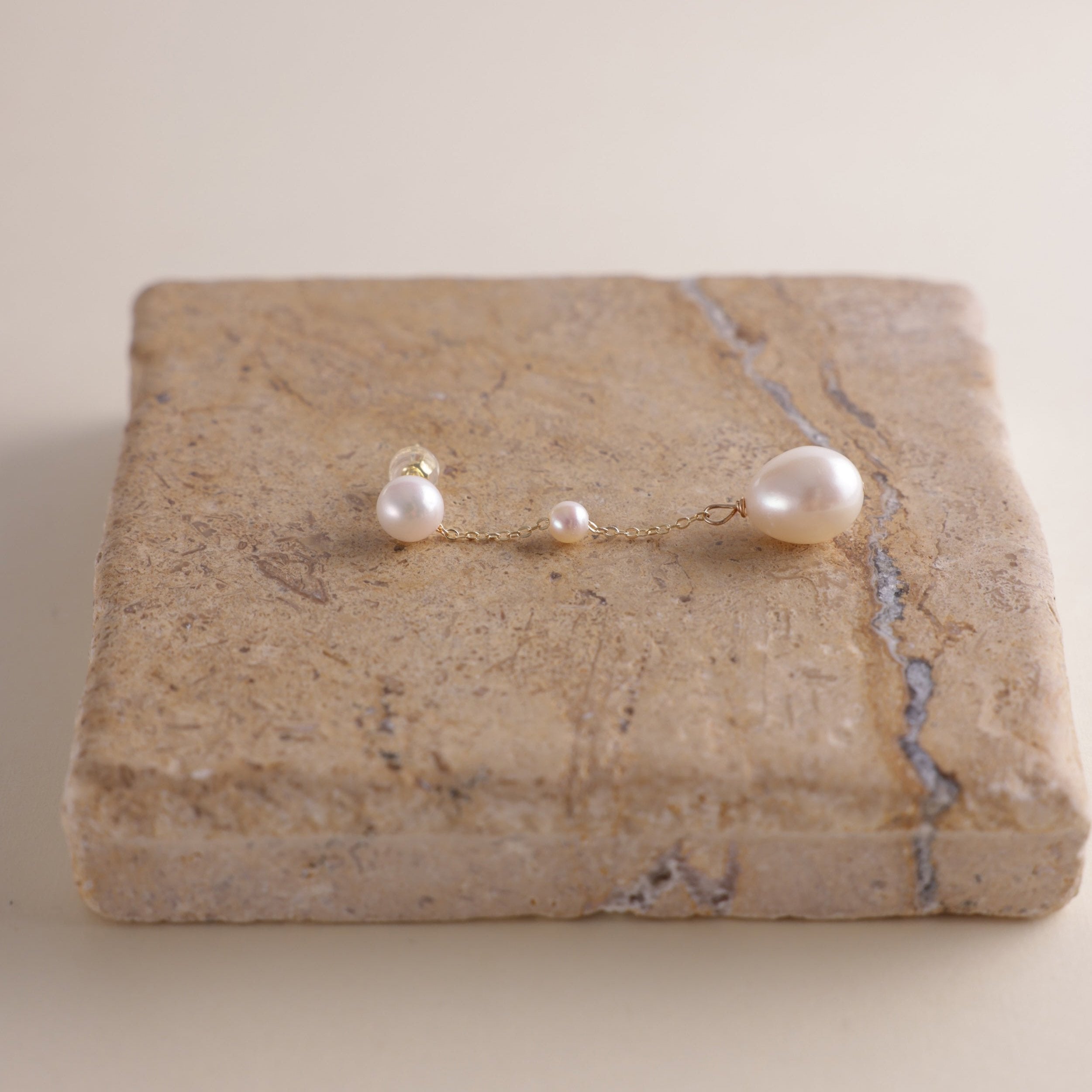 These elegant pearl drop earrings feature a gentle, cascading design of three pearls, meant to reflect the beauty of water droplets splashing into a serene surface. Crafted to add a soft glow to your look, these earrings symbolize vitality and positivity, reminding the wearer to approach life with energy and grace.
Materials & Craftsmanship: Each pair is handcrafted with care using lustrous freshwater pearls and high-quality, durable materials. We ensure every detail is perfected to create a radiant and lon