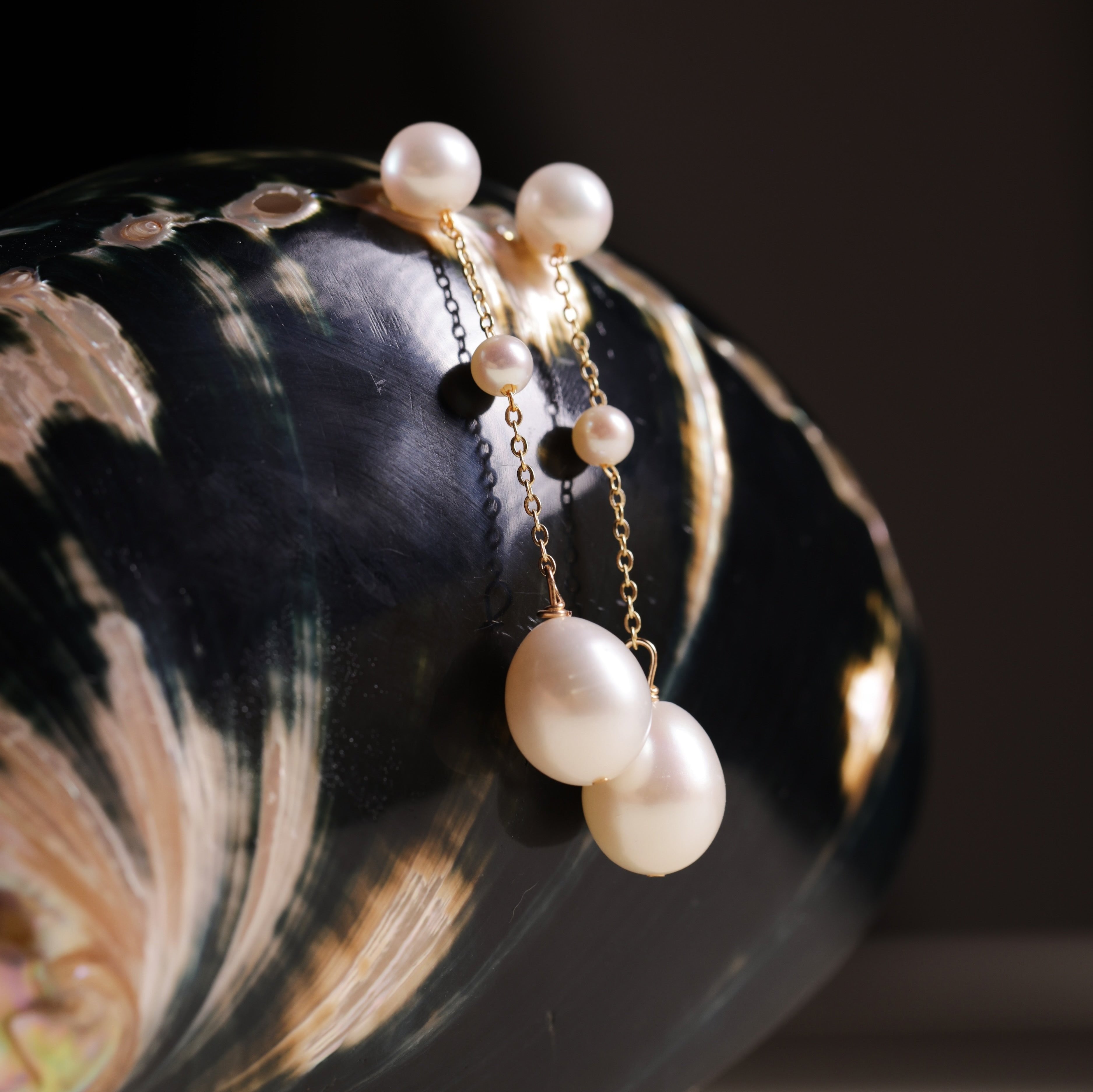 These elegant pearl drop earrings feature a gentle, cascading design of three pearls, meant to reflect the beauty of water droplets splashing into a serene surface. Crafted to add a soft glow to your look, these earrings symbolize vitality and positivity, reminding the wearer to approach life with energy and grace.
Materials & Craftsmanship: Each pair is handcrafted with care using lustrous freshwater pearls and high-quality, durable materials. We ensure every detail is perfected to create a radiant and lon