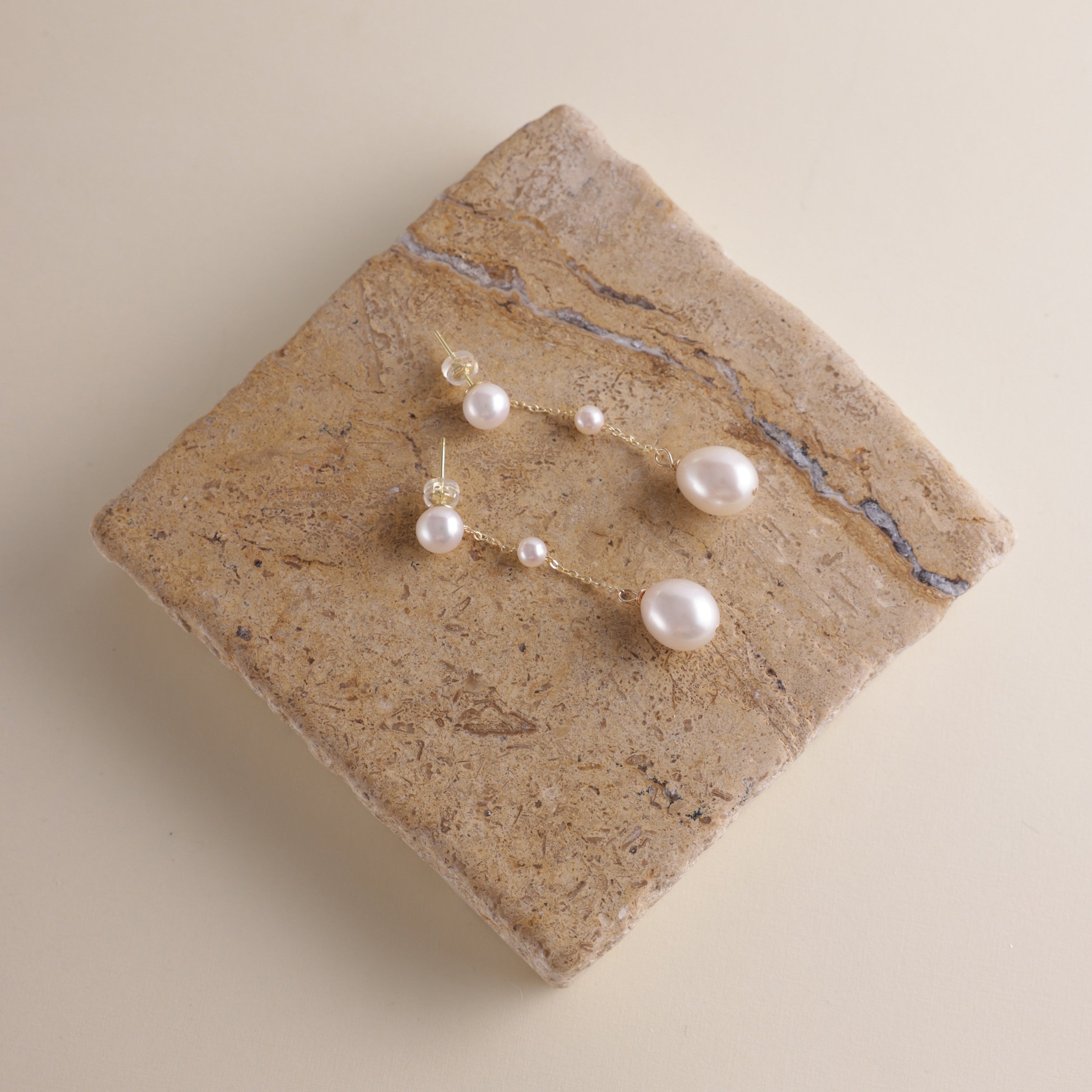 These elegant pearl drop earrings feature a gentle, cascading design of three pearls, meant to reflect the beauty of water droplets splashing into a serene surface. Crafted to add a soft glow to your look, these earrings symbolize vitality and positivity, reminding the wearer to approach life with energy and grace.
Materials & Craftsmanship: Each pair is handcrafted with care using lustrous freshwater pearls and high-quality, durable materials. We ensure every detail is perfected to create a radiant and lon