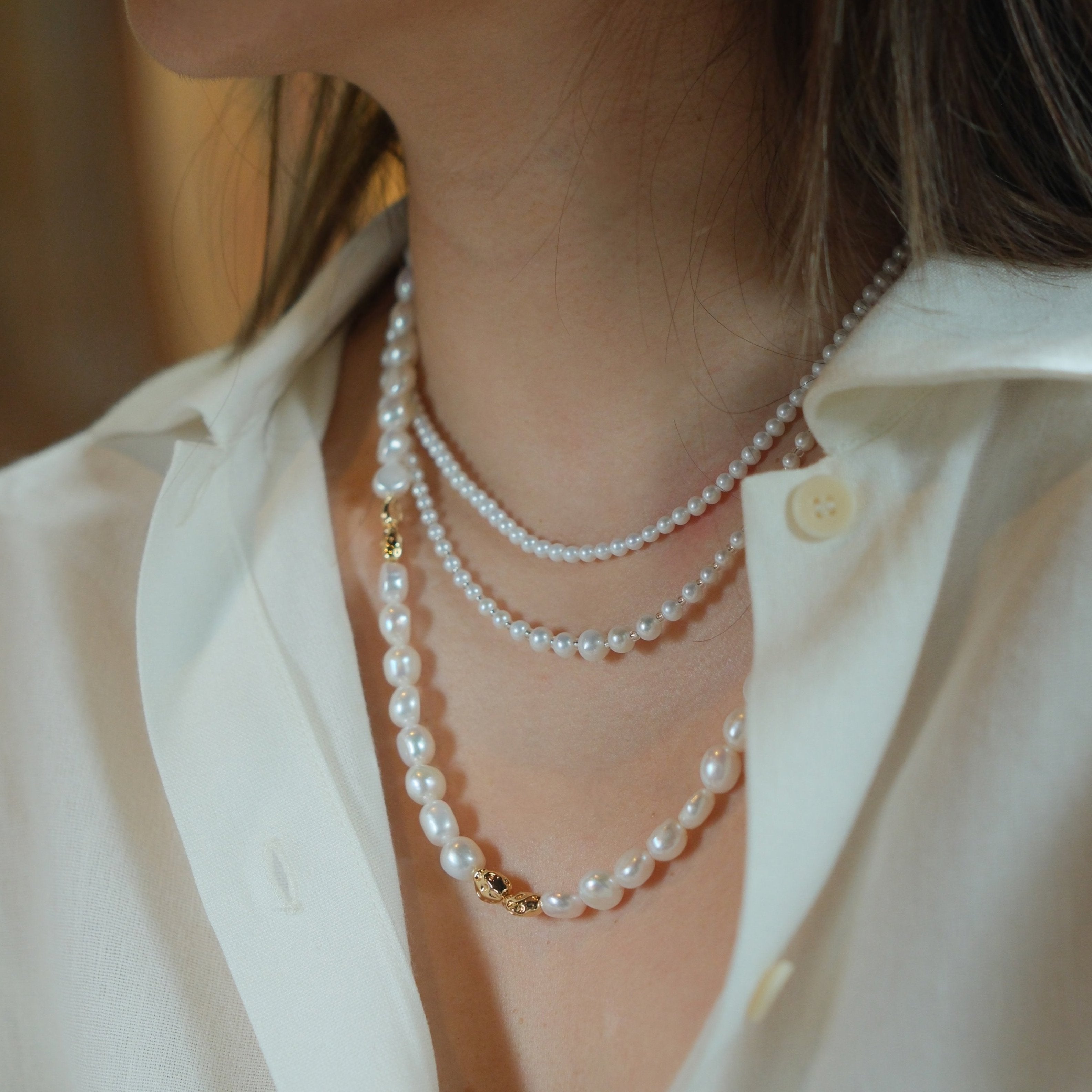 Freshwater Pearl Necklace and Bracelet Set | Versatile and Elegant | 18K Gold Filled | Gift for Her | Fall Outfit 
This set, featuring a smooth and lustrous collection of natural freshwater pearls, offers endless styling possibilities. Wear the necklace and bracelet separately or connect the clasps to create a chic long necklace. This versatile design is not only fun to wear but can be layered with one of our baroque pearl necklaces to create a more luxurious look. Whether worn individually or combined, the