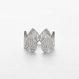 Silver openwork ring on a white background