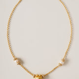 A celestial symphony of love and light, the Meiocardia Vulgaris Heart Necklace is a masterful blend of organic allure and cosmic opulence. Designed for those who seek to wear the stars and the sea, this piece balances bold symbolism with delicate harmony, celebrating the interplay of strength and softness.
Design & Craftsmanship:
Striking Heart Pendant: The centerpiece is a 15.6*18.8mm Meiocardia vulgaris heart bead, cast in lustrous S925 silver and plated with 18k gold. Its dual-textured surface—rugged edg