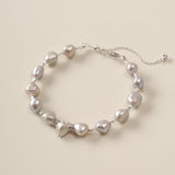 A celestial dance of contrasts, the Meiocardia Vulgaris & Keshi Pearl Bracelet unites the raw magic of ocean-born treasures with the shimmering mystery of the cosmos. Designed for free spirits who embrace imperfection as art, this piece blends a rare heart-shaped shell bead with the organic allure of keshi pearls—a testament to beauty forged in nature’s unpredictable hands.
Design & Craftsmanship:
- Dual-Perspective Heart Charm: The focal 8.0*9.8mm Meiocardia vulgaris bead, cast in hypoallergenic S925 silve