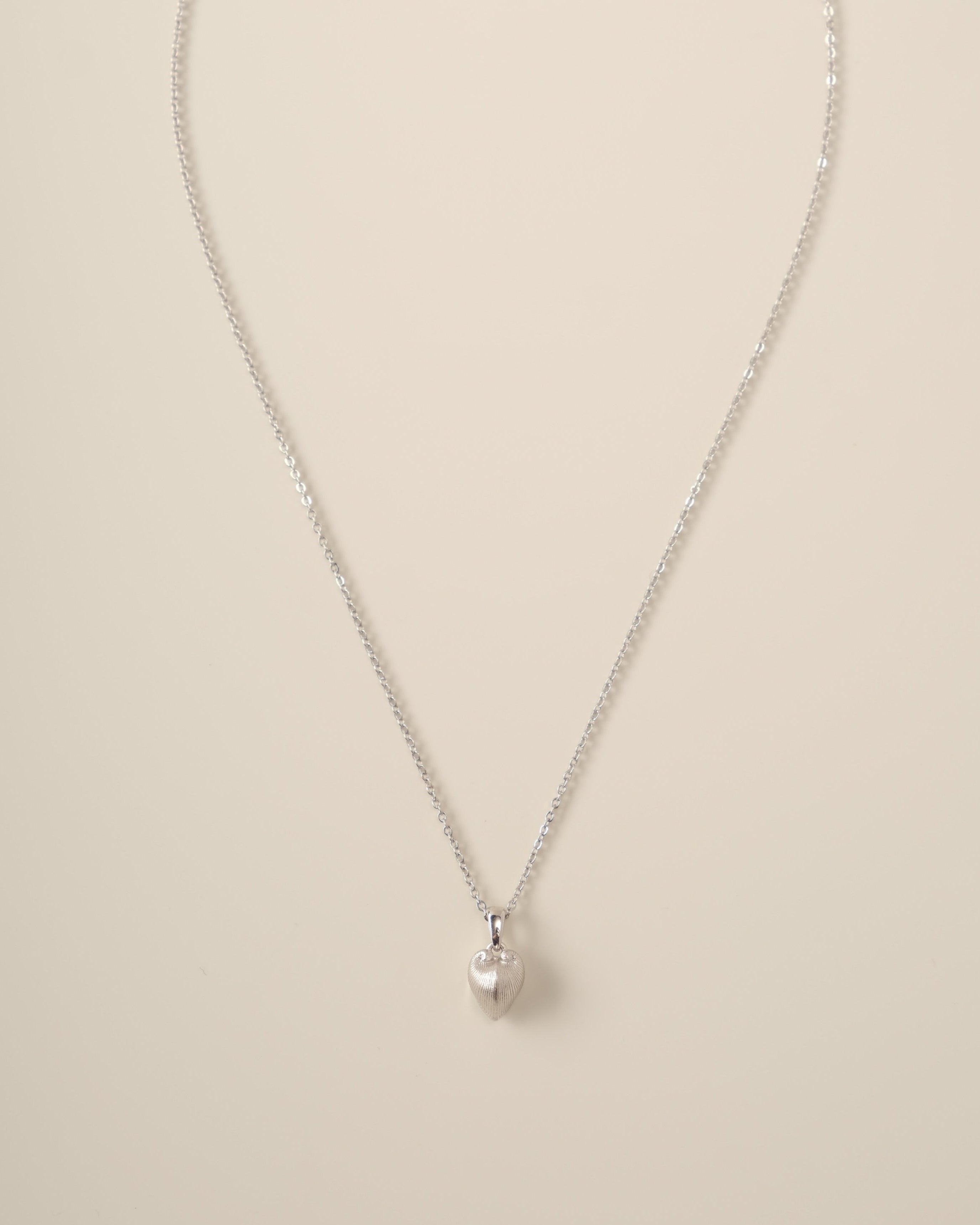 Embodying duality and grace, the Meiocardia Vulgaris Heart Pendant is a wearable ode to nature’s hidden artistry. Inspired by the rare marine bivalve that shifts from rugged horns to a perfect heart shape, this pendant captures life’s balance of resilience and tenderness.
Design & Craftsmanship:
- Intricate 3D Sculpture: Meticulously modeled from a scanned Meiocardia vulgaris shell, the pendant (8.0*9.8mm) mirrors the organism’s dual perspectives—rugged texture on the edges, smooth heart contours at the cen