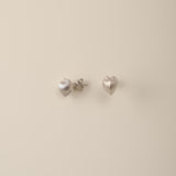 Embrace the celestial harmony of resilience and tenderness with our Petite Cœur Brillant Heart Earrings, inspired by the enigmatic Meiocardia vulgaris shell. Exquisitely crafted in 925 silver plated with luxurious 18k gold or white gold, these earrings feature a delicate heart silhouette (8.0*9.8mm). Each piece is a testament to meticulous artistry, born from 3D-scanned precision and hand-finished by master artisans.
Design Details & Materials:  
Dual-Tone Elegance: Choose between warm 18k gold or cool whi