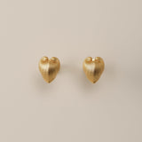 Embrace the celestial harmony of resilience and tenderness with our Petite Cœur Brillant Heart Earrings, inspired by the enigmatic Meiocardia vulgaris shell. Exquisitely crafted in 925 silver plated with luxurious 18k gold or white gold, these earrings feature a delicate heart silhouette (8.0*9.8mm). Each piece is a testament to meticulous artistry, born from 3D-scanned precision and hand-finished by master artisans.

Design Details & Materials:  
Dual-Tone Elegance: Choose between warm 18k gold or cool whi