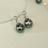 Just like the matching necklace, these earrings were inspired by my mom’s love for Tahitian pearls. She always adored their elegance but wanted a design that could be worn every day, not just for special occasions. To create a more versatile and youthful look, I paired these rich Tahitian black pearls with shimmering blue Akoya pearls and a touch of sparkle with a diamond accent. 
Materials:
- Tahitian black pearls
- Blue Akoya pearls
- Sparkling cubic zirconia (man-made diamond)
- Silver accents
- All hand