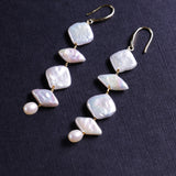 Unique Geometric Freshwater Pearl Dangle Earrings – A Fusion of Shapes and Elegance | Gift for Her | Fall Outfit 
These pearl earrings feature a striking design that harmoniously combines three different pearl shapes: a rhombus-shaped pearl, a square-shaped pearl, and a teardrop-shaped pearl. Despite their distinct forms, these pearls come together to create an elegant and balanced look that is both gentle and strong. Perfect for adding a touch of uniqueness to your everyday outfit