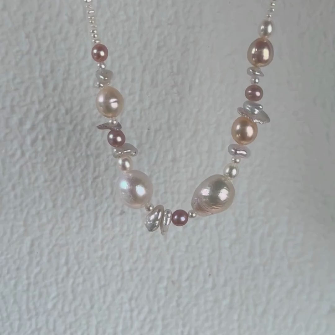 The seaside treasure pearl necklace can be customized to match your favorite color palette! Featuring a stunning mix of pink-hued freshwater pearls—Baroque pearls, Keshi pearls, round pearls, and tiny seed pearls—this necklace is a one-of-a-kind piece. Each strand is handmade with love and care, ensuring that your necklace is truly special and as unique as you are.

The Meaning Behind Pink Pearls & Baroque Pearls