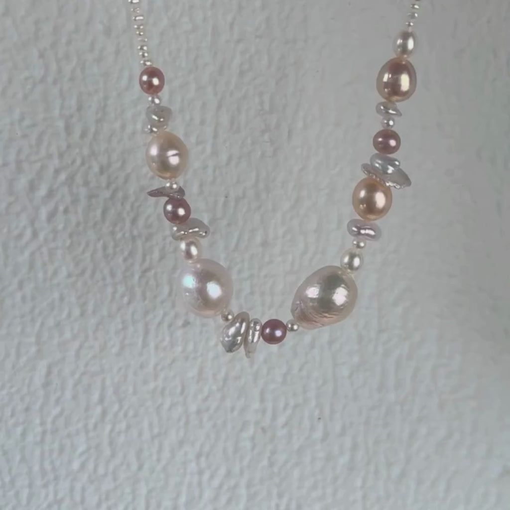 The seaside treasure pearl necklace can be customized to match your favorite color palette! Featuring a stunning mix of pink-hued freshwater pearls—Baroque pearls, Keshi pearls, round pearls, and tiny seed pearls—this necklace is a one-of-a-kind piece. Each strand is handmade with love and care, ensuring that your necklace is truly special and as unique as you are.

The Meaning Behind Pink Pearls & Baroque Pearls